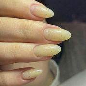 Halo Glow rubber base gel NZ applied on almond nails - sheer pastel yellow with a hint of shimmer by Nails Factor Supplies