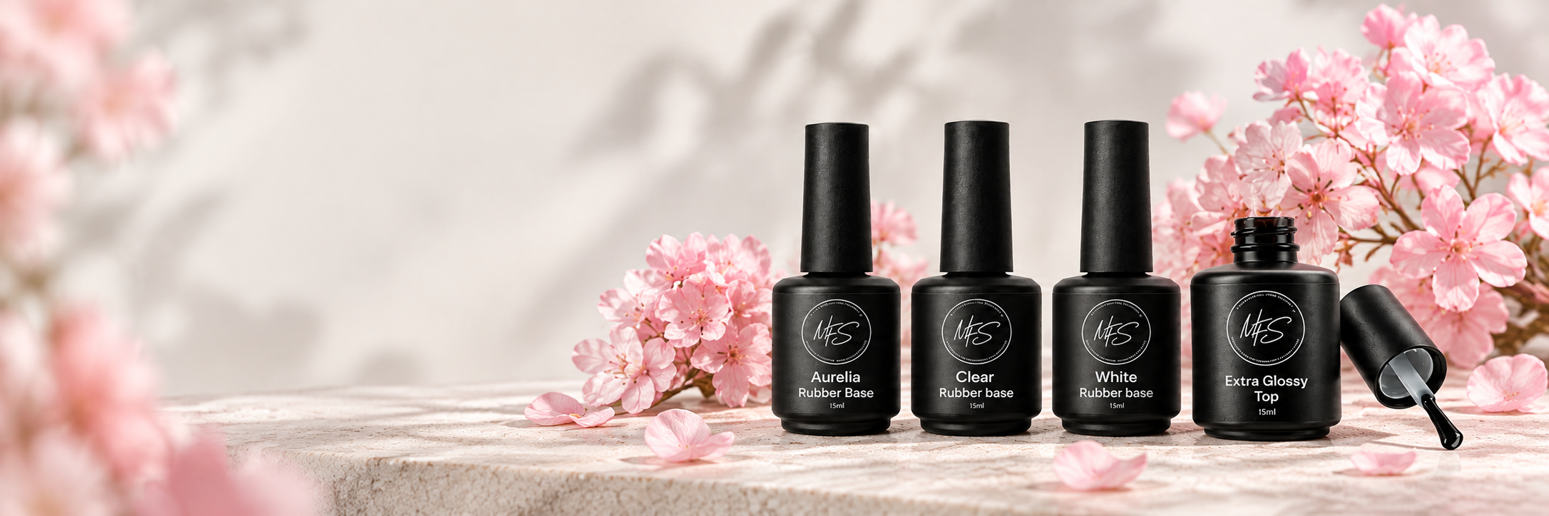 Nail_care_bottles_among_blush_blooms.png
